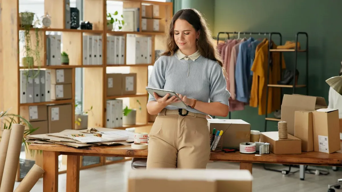 Ecommerce store owner working through a Shopify migration SEO checklist on a tablet