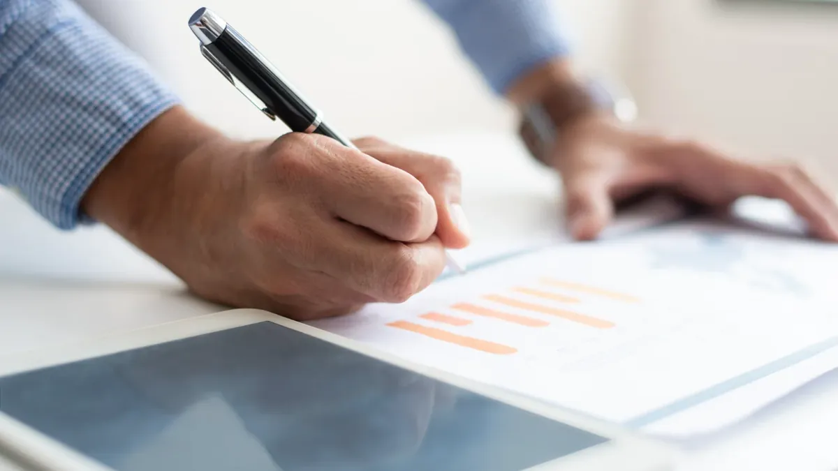 Store owner reviewing website traffic data after a WooCommerce to Shopify migration